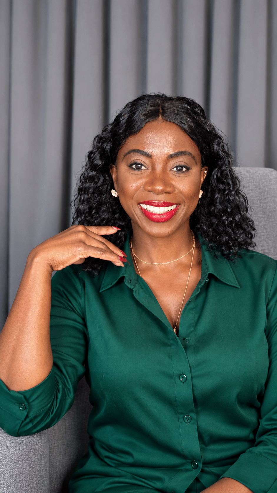 Coach Titilayo in an emerald green outfit